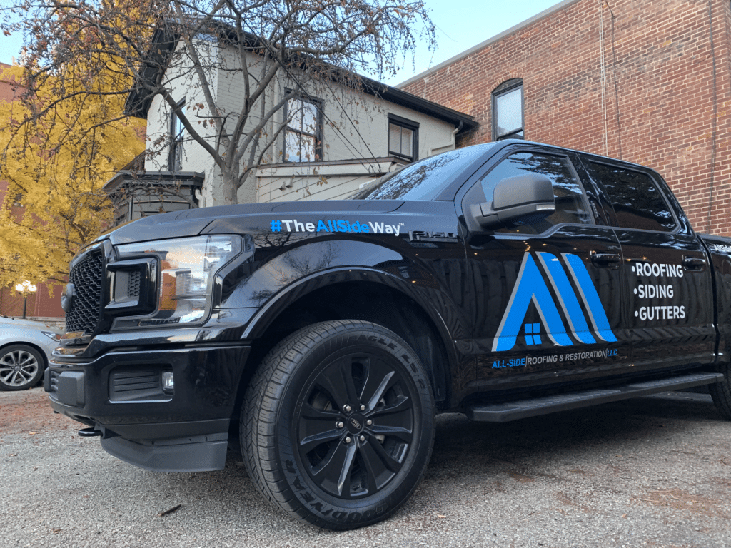 A black truck branded with 