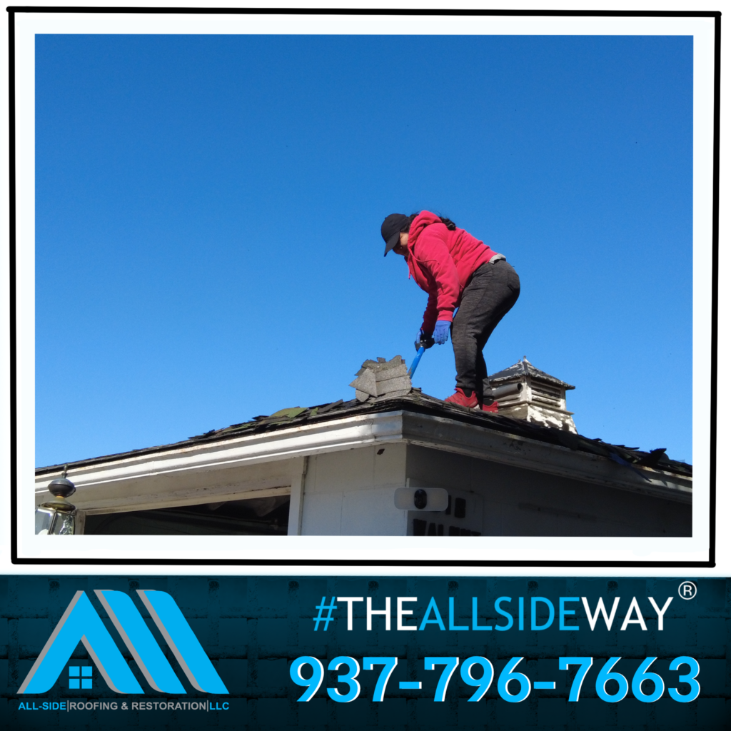 A person in a red jacket repairs roof shingles under a clear blue sky in Jamestown OH. All-Side Roofing branding and Roof Repair number are visible.