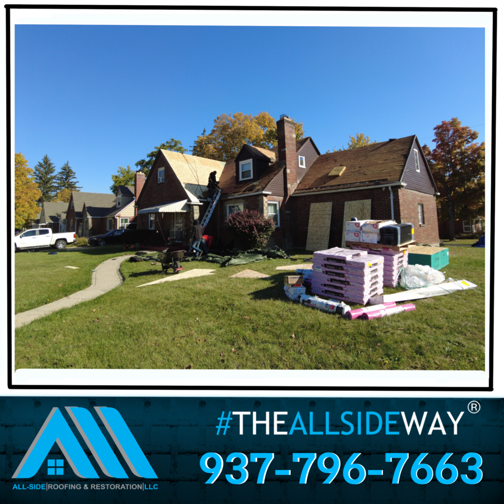 A house in Greenville OH with roofing materials on the lawn and workers doing roof repair; All-Side Roofing & Restoration contact info is displayed.