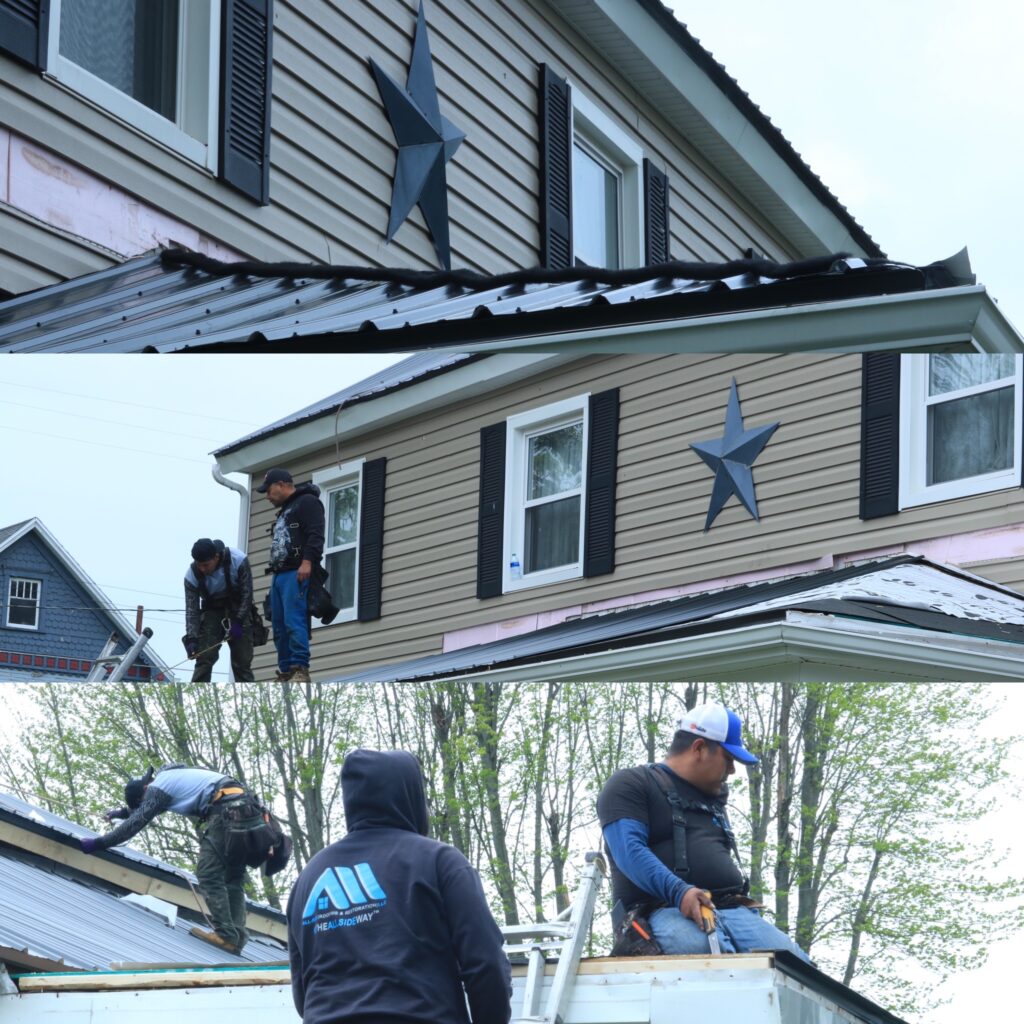 Three workers in safety gear install metal roofing panels during a roof replacement on a beige Oakwood, OH two-story house with decorative star.