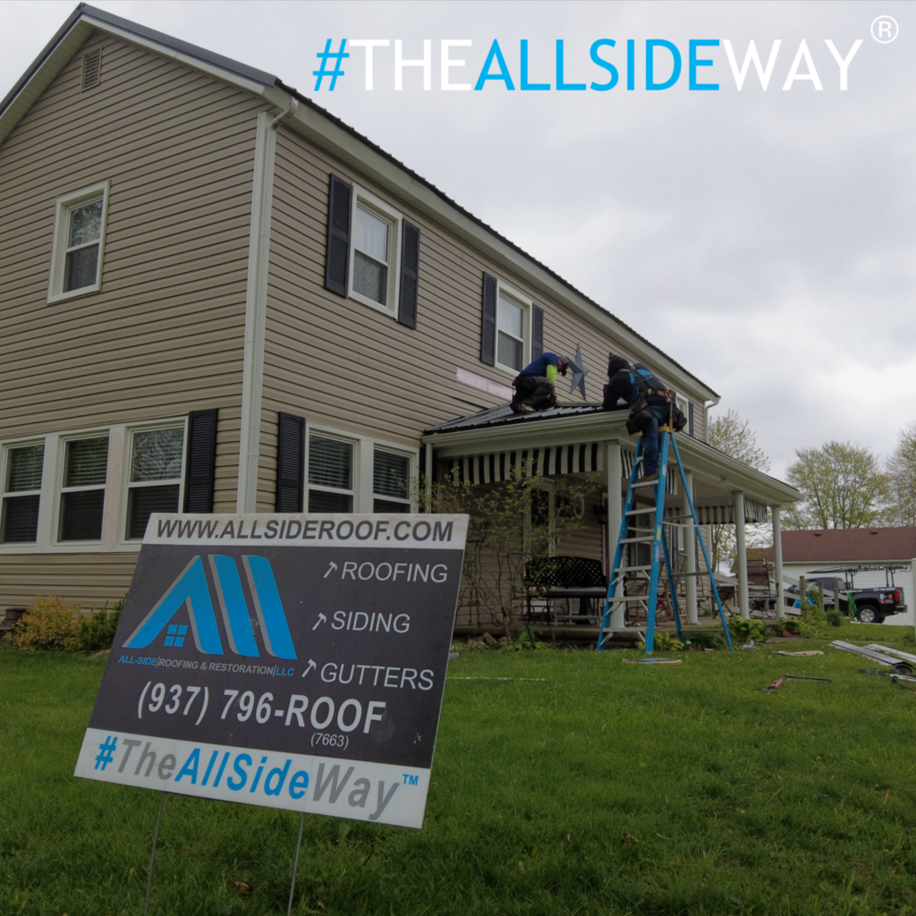 Roofing crew completing roof replacement in Middletown, OH, on a residential property